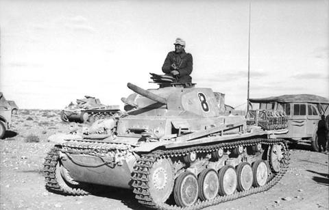Period photograph: a light tank with the number 8 on its turret in the desert